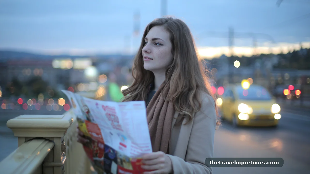 A young woman traveler holding a map on a city street at dusk
