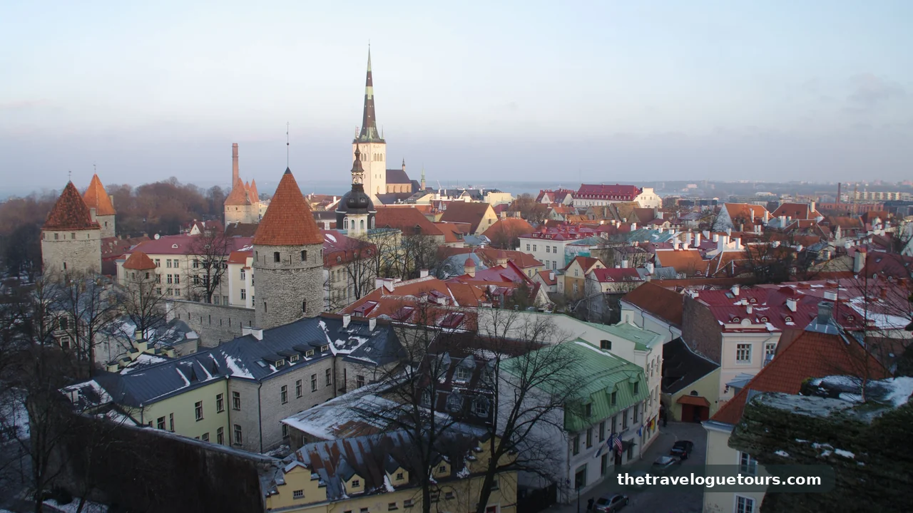 Aerial view of Tallinn's historic old town with red rooftops and medieval architecture under winter skies