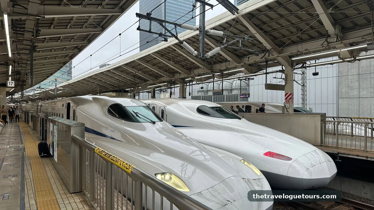 Two shinkansen bullet trains lined up at a platform at Tokyo Station, Japan